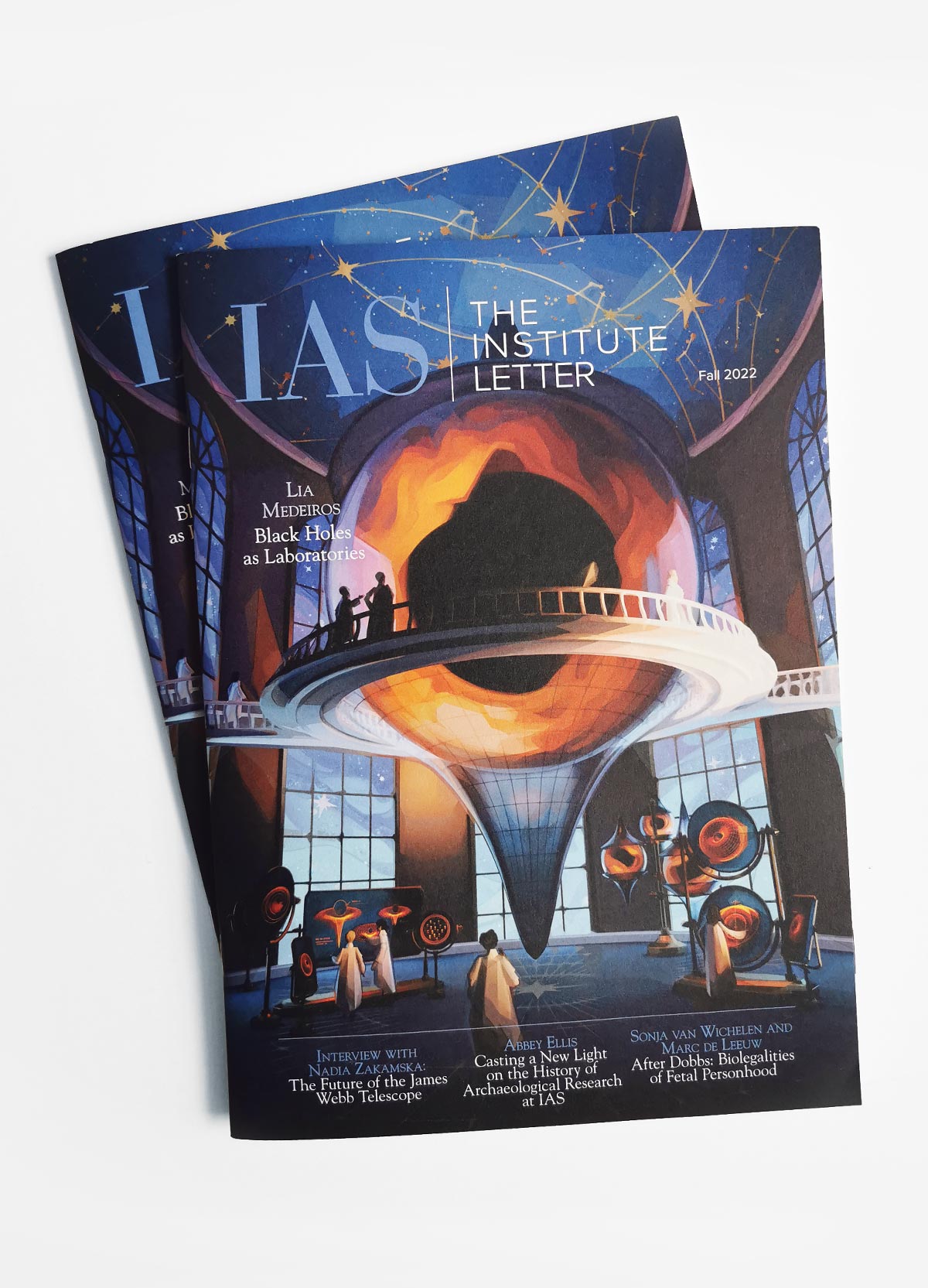 Photo of the cover of IAS: The Institute Letter. Featuring art of a black hole laboratory in a retro-futuristic style.