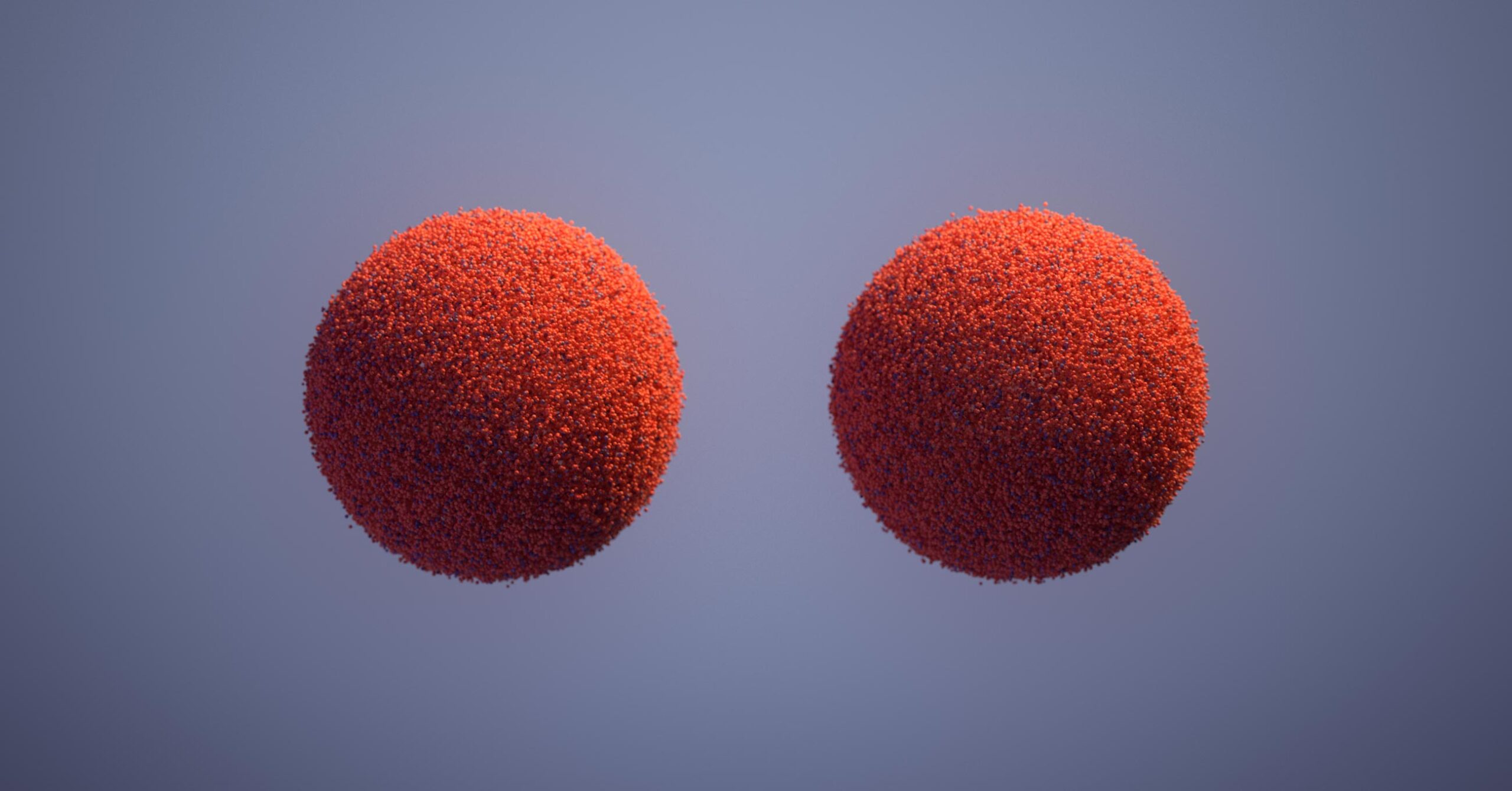 3D art: orange spheres made up of millions of tiny particles.