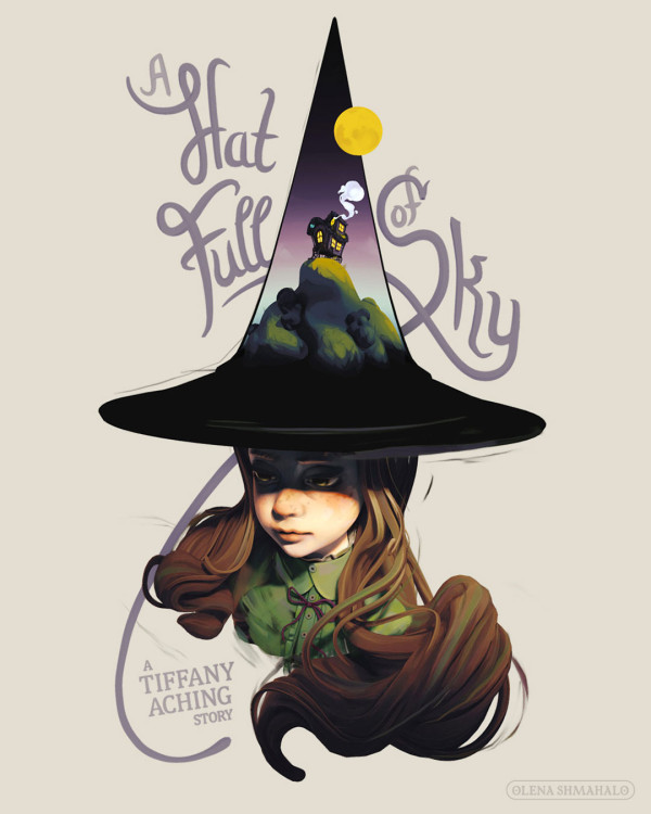 Painted 3D sculpture of a girl with brown hair wearing a witch hat. The top of the hat is a cutaway diorama of a landscape: a shepherd's hut on a hill. Hand-lettering around the girl says 